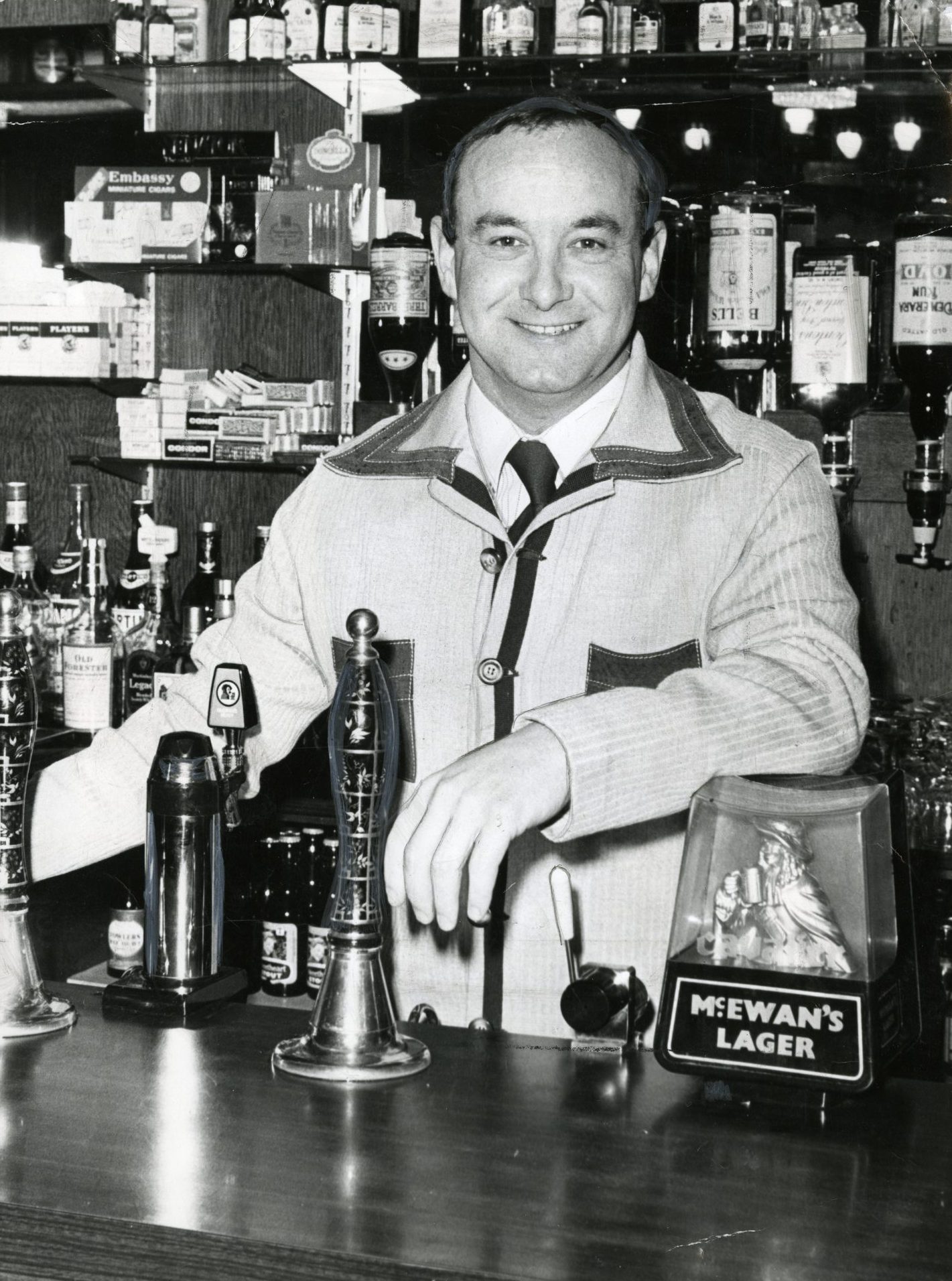 a smiling Jeff Stewart behind the bar in February 1978