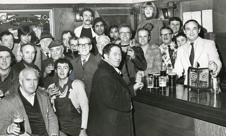 Jeff Stewart serving on a busy day at Dundee pub The Three Barrels