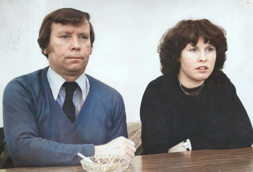 James McCabe and his daughter Evelyn sitting at a desk in 1980. 