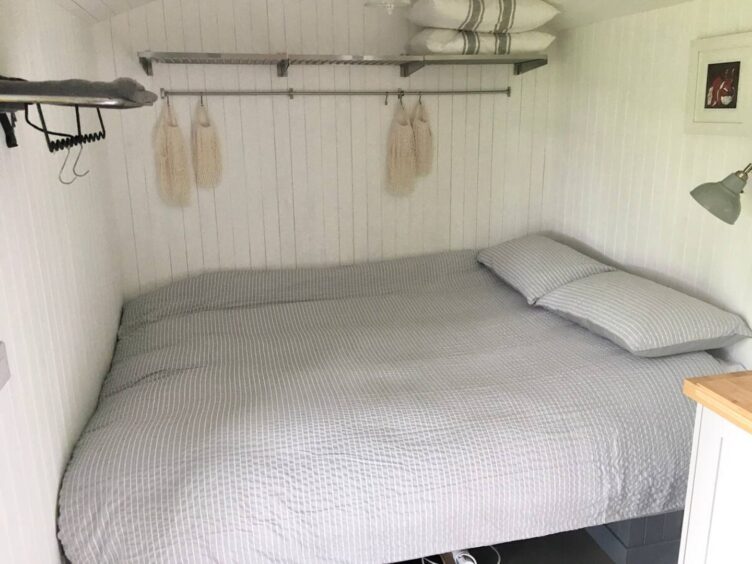 Bedroom in a converted railway wagon in Dungarthill, three miles from Dunkeld.