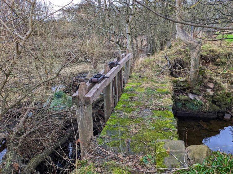 The remains of a bridge and sluice at Aldbar dam