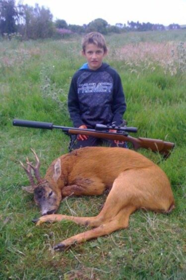 Brandon Robb and deer he killed