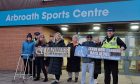 Councillor Lois Speed (third from left) with blue badge holders, parent carers and the council community enforcement wardens outside Arbroath Sports Centre. Image: Angus Council