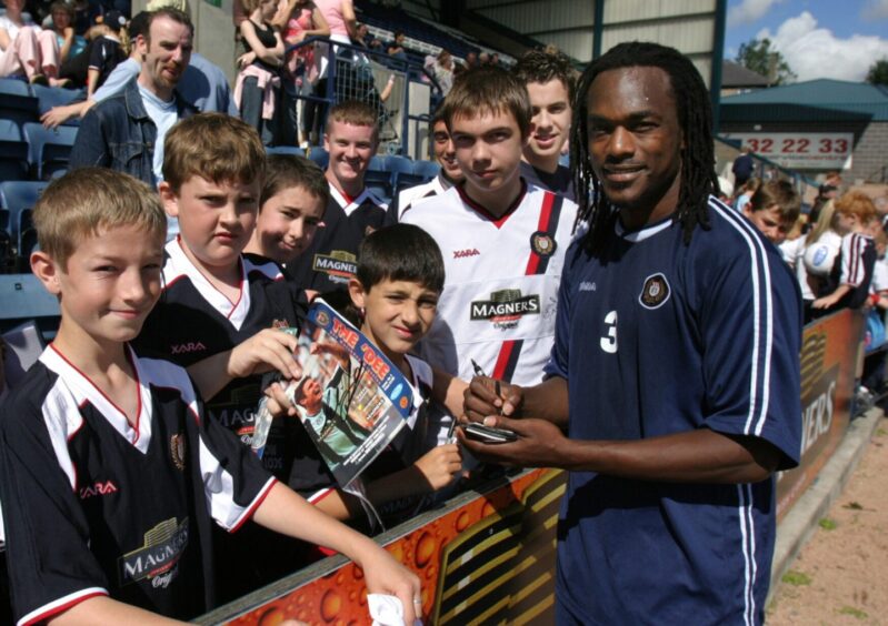 Brent Sancho signs his autograph for supporters in 2004.