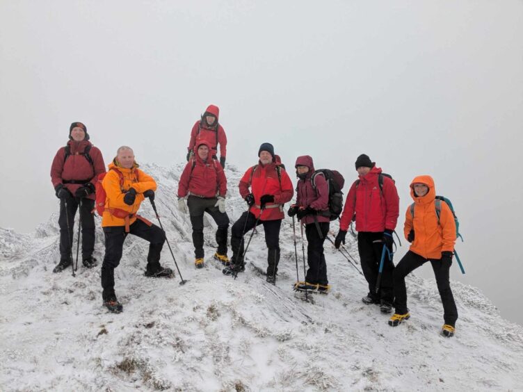 Members of The Grampian Club on one of the summits of Ben Venue