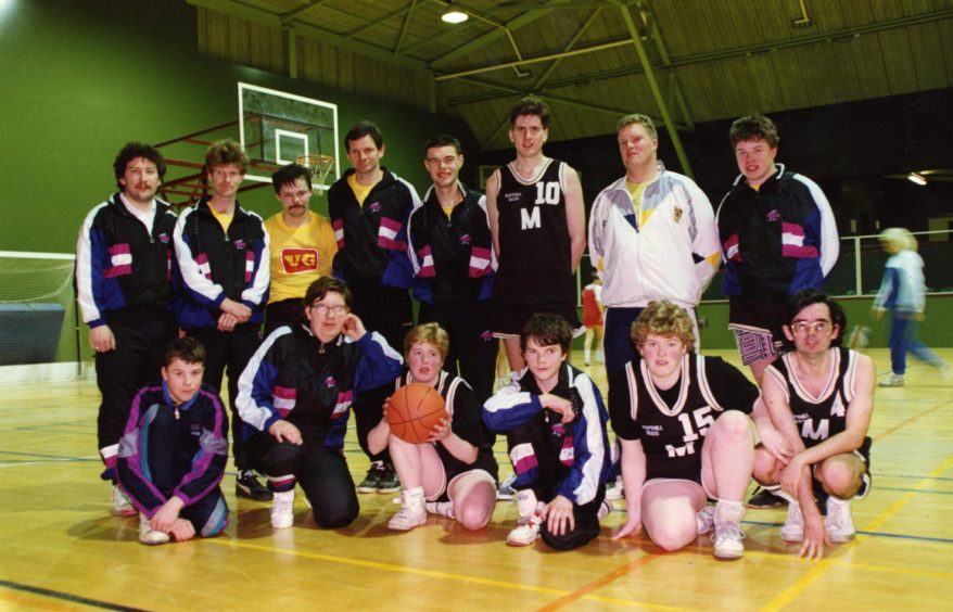 The Dundee Mavericks team pose for a picture in a gym in 1992