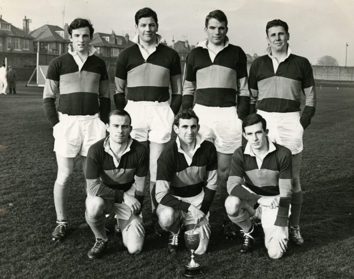 Dundee High School FP players pose with a trophy