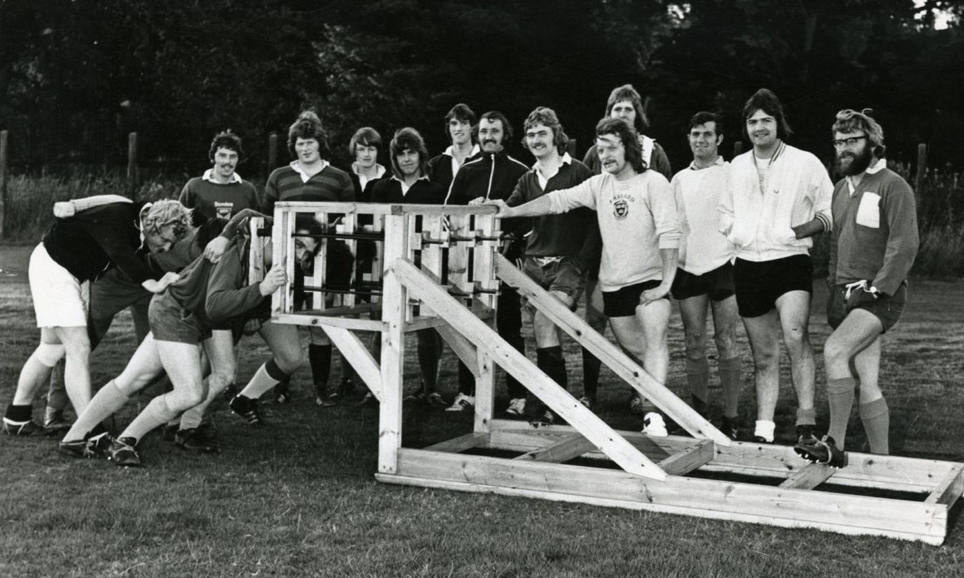 Members of the Harris FP rugby team with their new scrum machine in September 1974.