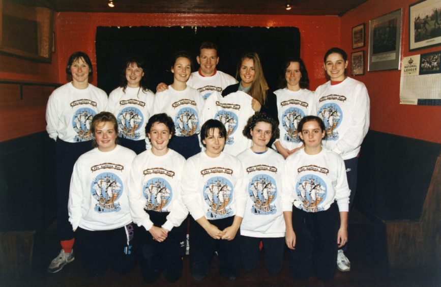 Andy Nicol and the women's team with their new jerseys