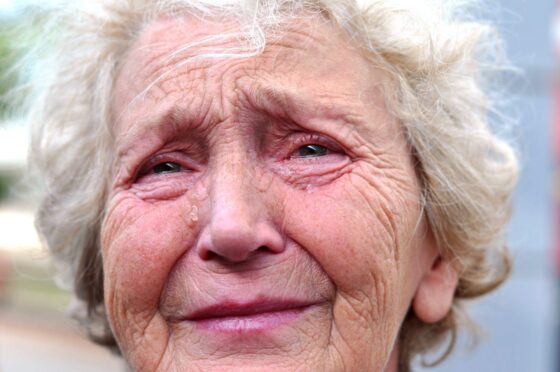 elderly woman crying. but those who need adult support and protection in Fife can get help