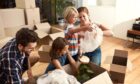 parents with children, playing and bonding together as they are moving house in UK