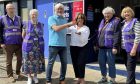 Council leader grant Laing handing keys to group of volunteers in front of Blairgowrie toilet block