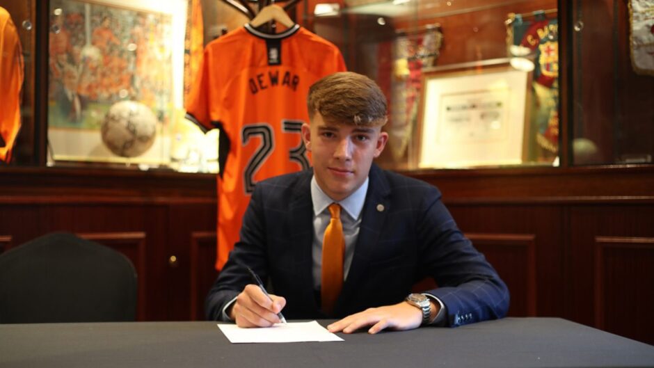 Charlie Dewar, pictured penning his United contract in 2023, joining from English side South Shields