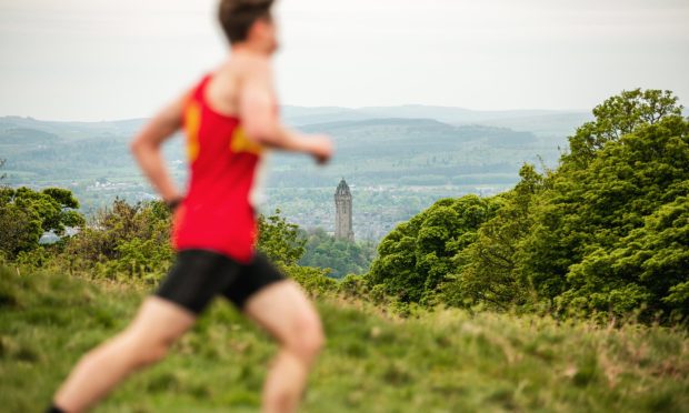 CR0048069. Dumyat, Stirling. The 49th Dumyat Hill Race. A view of the National Wallace Monument from Dumyat. 8th May 2024. Image: Eve Conroy / DC Thomson