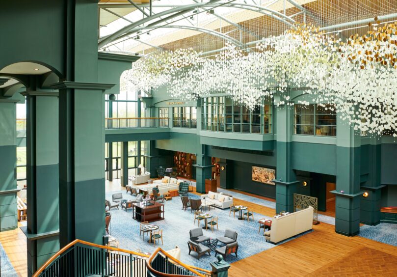 the view from above The Atrium area in The Fairmont Hotel in St Andrews. The spacious, glass covered dining and sitting area features a large glass sculpture.