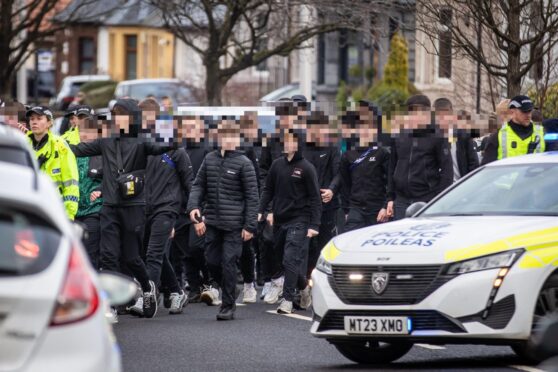 To go with story by Bryan Copland. **FULLY BLURRED VERSION**

BESTPIC - CR0051880, Neil Henderson, Dunfermline. Police Scotland Crowd Control Operation invite for Derby Day. Picture Shows:Young fans are escorted into East End Park for Derby Day in Dunfermline which see's Dunfermline Athletic play Raith Rovers. Saturday 1st February 2025
Image: Steve Brown/DC Thomson Picture shows; Fife derby. Dunfermline. Supplied by Steve Brown/DC Thomson Date; 01/02/2025