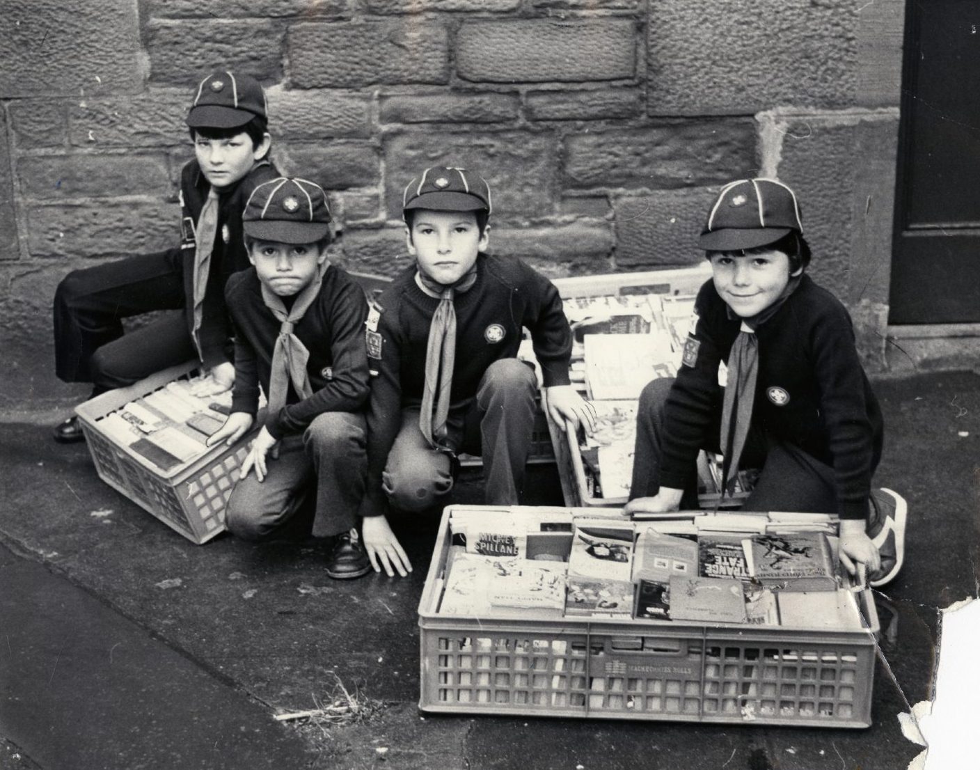 Cubs collecting books in crates in November 1981.