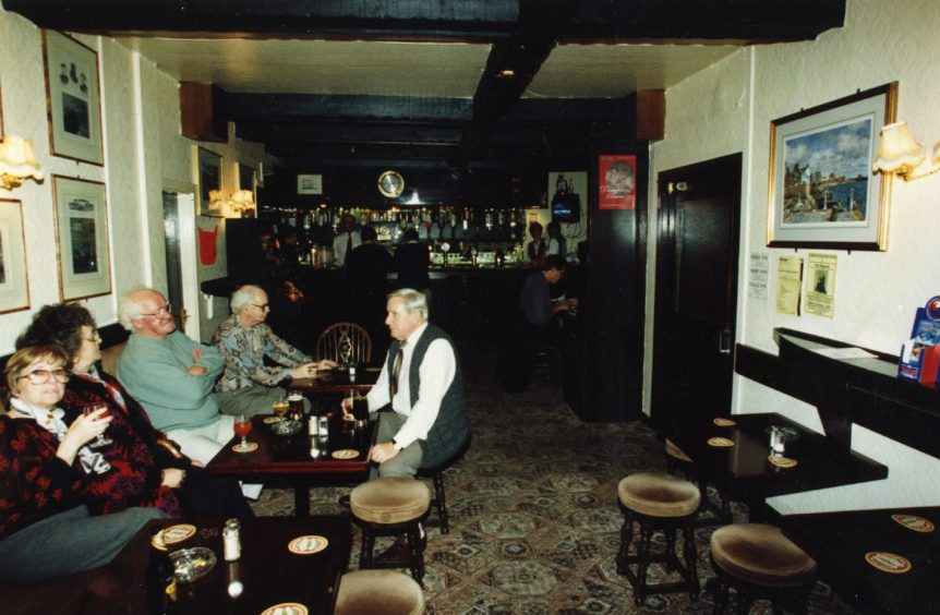 people at a table in The Ferry Inn in 1995