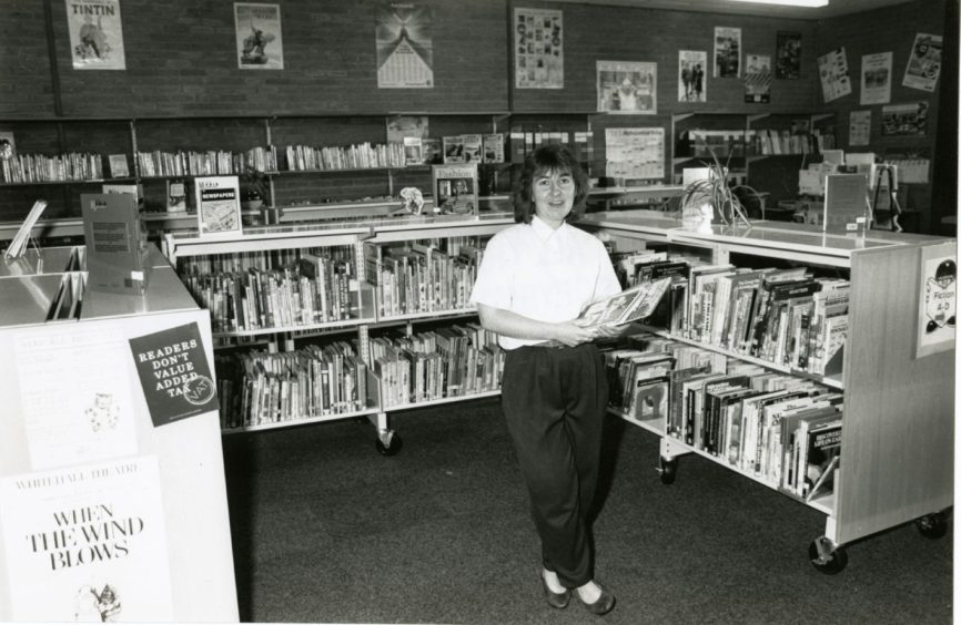 a librarian inside Grove Academy's library in May 1989.