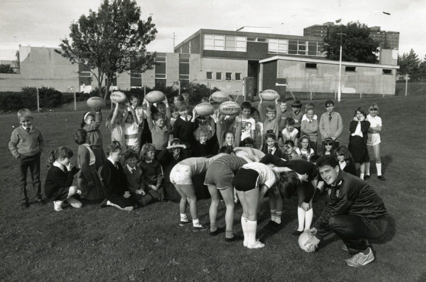 Whitfield Primary School pupils being taught rugby by the Scottish Rugby Union's Youth Development Officer Colin Robertson in September 1989.