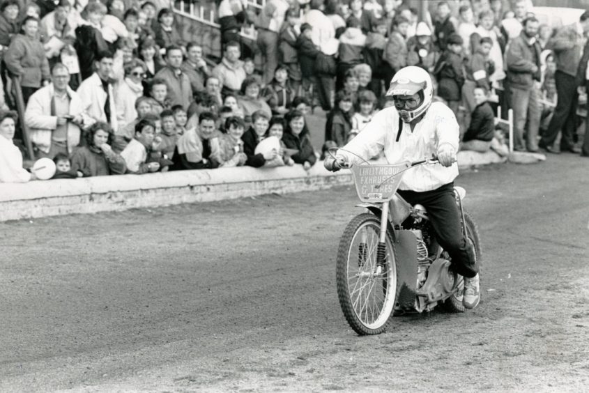 Angus Cook on a bike, having a go at speedway.