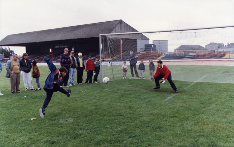 John McQuillan in goal for beat-the-goalie at a Dundee FC open day.