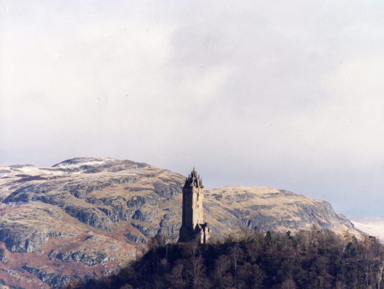 The Wallace Monument in Stirling with the Ochil Hills in the distance