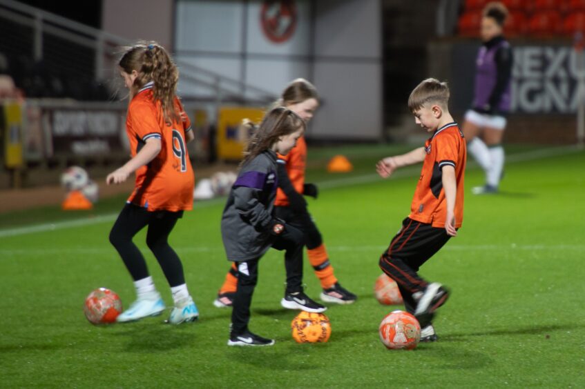 The mascots enjoyed a kickabout on the Tannadice turf