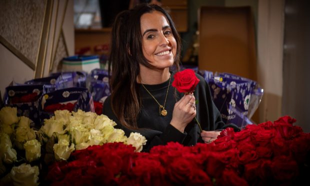 Jodi Gray surrounded by hundreds of Valentine's Day roses at her luxury florist, Bloom, on Dundee's Strathmartine Road.