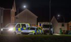 Police vehicles in Larach Court. Image: Kim Cessford / DC Thomson