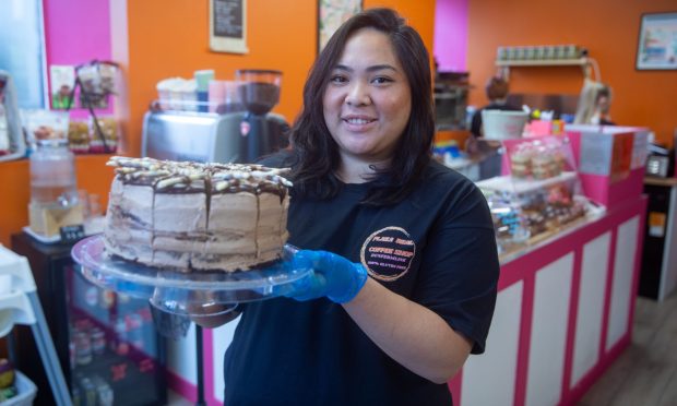 Jiordia Wragg with one of her homemade gluten-free cakes. Image: Kenny Smith/DC Thomson