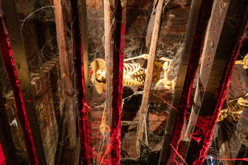 A skeleton on display in the Creepy Wee Pub.