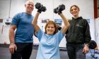 Perth singing legend Eve Graham at the gym with personal trainers Claire Bloice and Gordon Robertson.