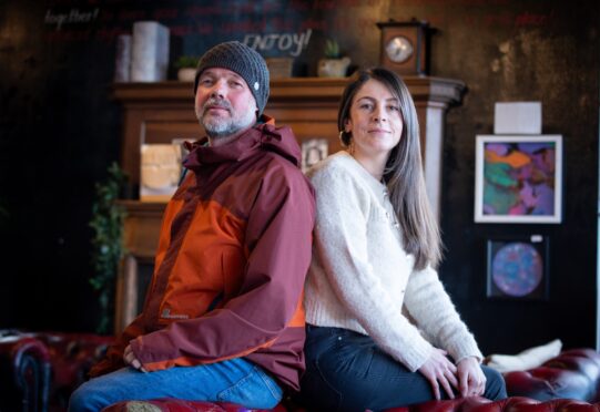 Mark Richardson and Rana Marathon sitting on leather sofa in Blend Coffee Lounge, Perth