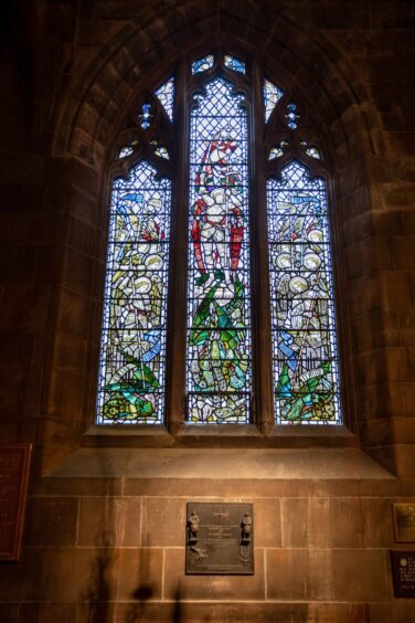 Stained glass window inside St John's Kirk