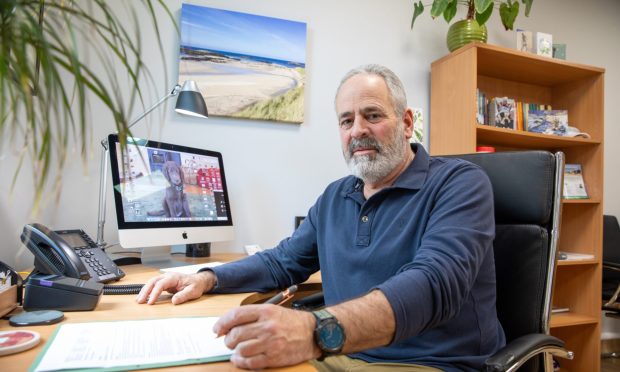 Dr Kyle Lifson at desk