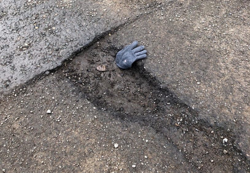 The potholes in School Brae, Letham, are several inches deep