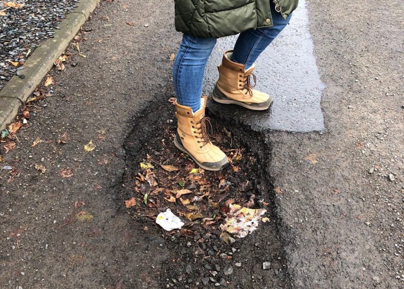 Huge potholes mar the road to Letham Primary School in Fife