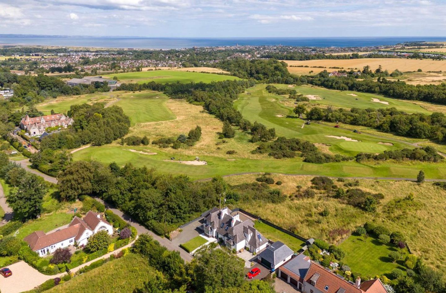 An aerial view captures Mid Brae's stunning location close to St Andrews.