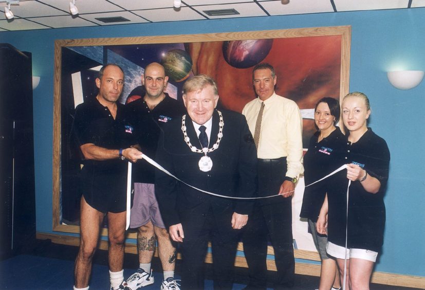 Staff with Provost Tommy Brookes at the fitness suite opening at the pool