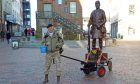 Robin Hood towing cart with wooden sculpture of soldier on board