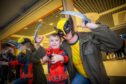 Darren Young (wolverine) with son Laucklan (aged 5) as Deadpool from Dundee. Image: Steve MacDougall/DC Thomson