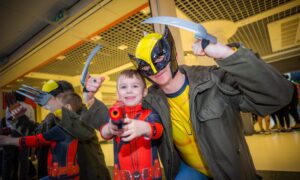 Darren Young (wolverine) with son Laucklan (aged 5) as Deadpool from Dundee. Image: Steve MacDougall/DC Thomson