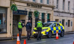 Police outside the New County Hotel in the hours following the fire. Image: Steve MacDougall/DC Thomson