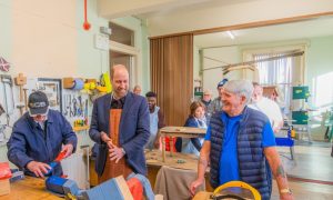 Prince William at Carnoustie and Monifieth Men's Shed, with member Alex Campbell (left) and chairman Derek Stewart. Image: Steve MacDougall/DC Thomson