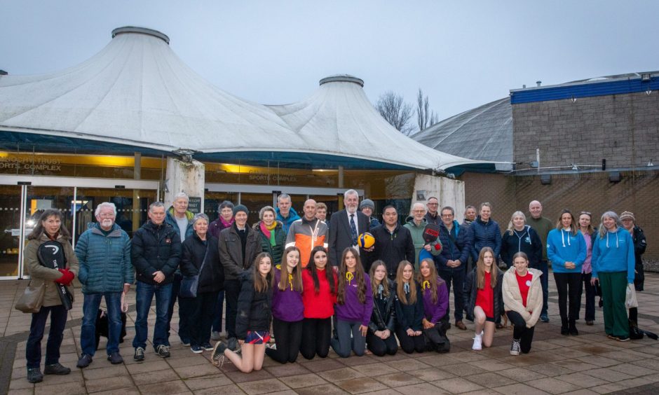 Group of people lined up outside Bell's Sports Centre in Perth