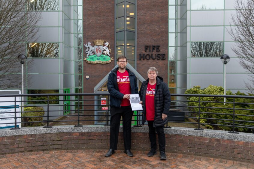 Graeme Keir and Jane McKeown outside Fife House in Glenrothes with the petition.