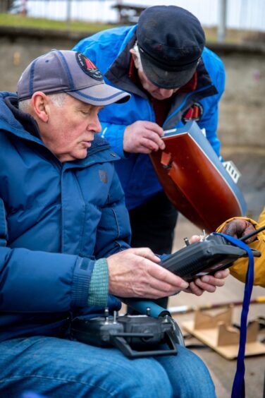 Image shows: two older men having a chat about their model boats.