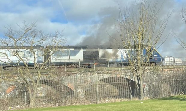 The ScotRail train has caught fire near Dundee railway station. Image: Charlie Anderson