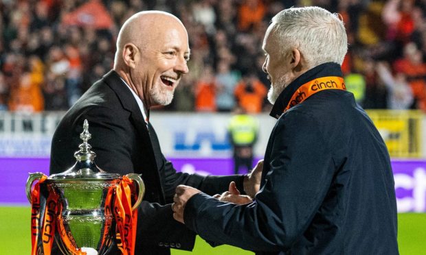 Mark Ogren, left, congratulates Goodwin after leading Dundee United to the Championship title.